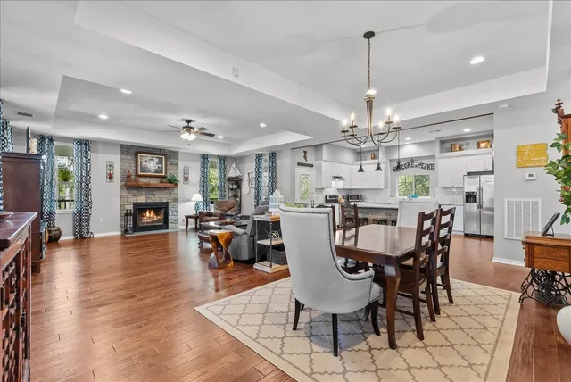 a view of a dining room with furniture and wooden floor