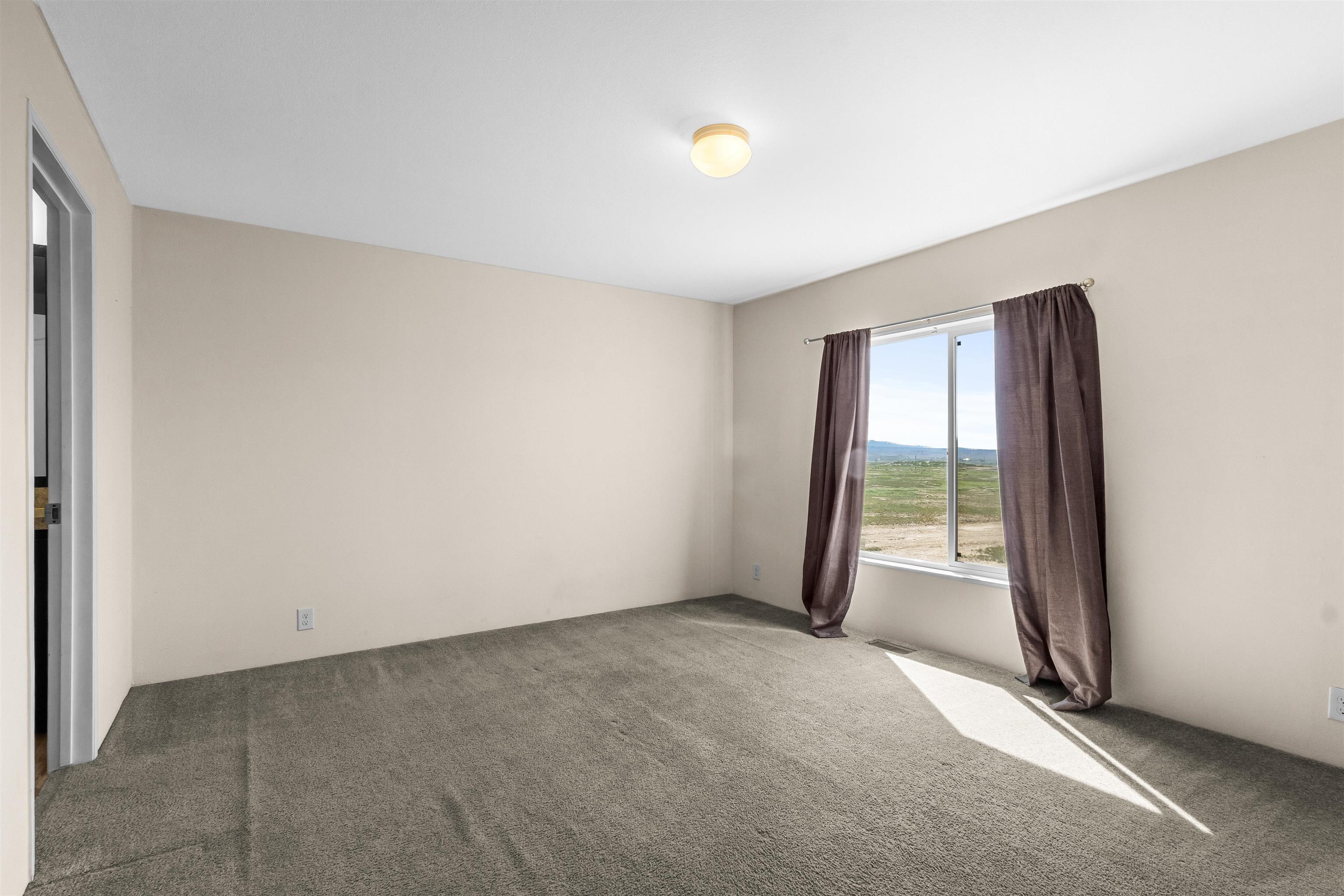 759 33 Road Clifton, CO 81520 - Photo 18 of 35 a view of an empty room with a window