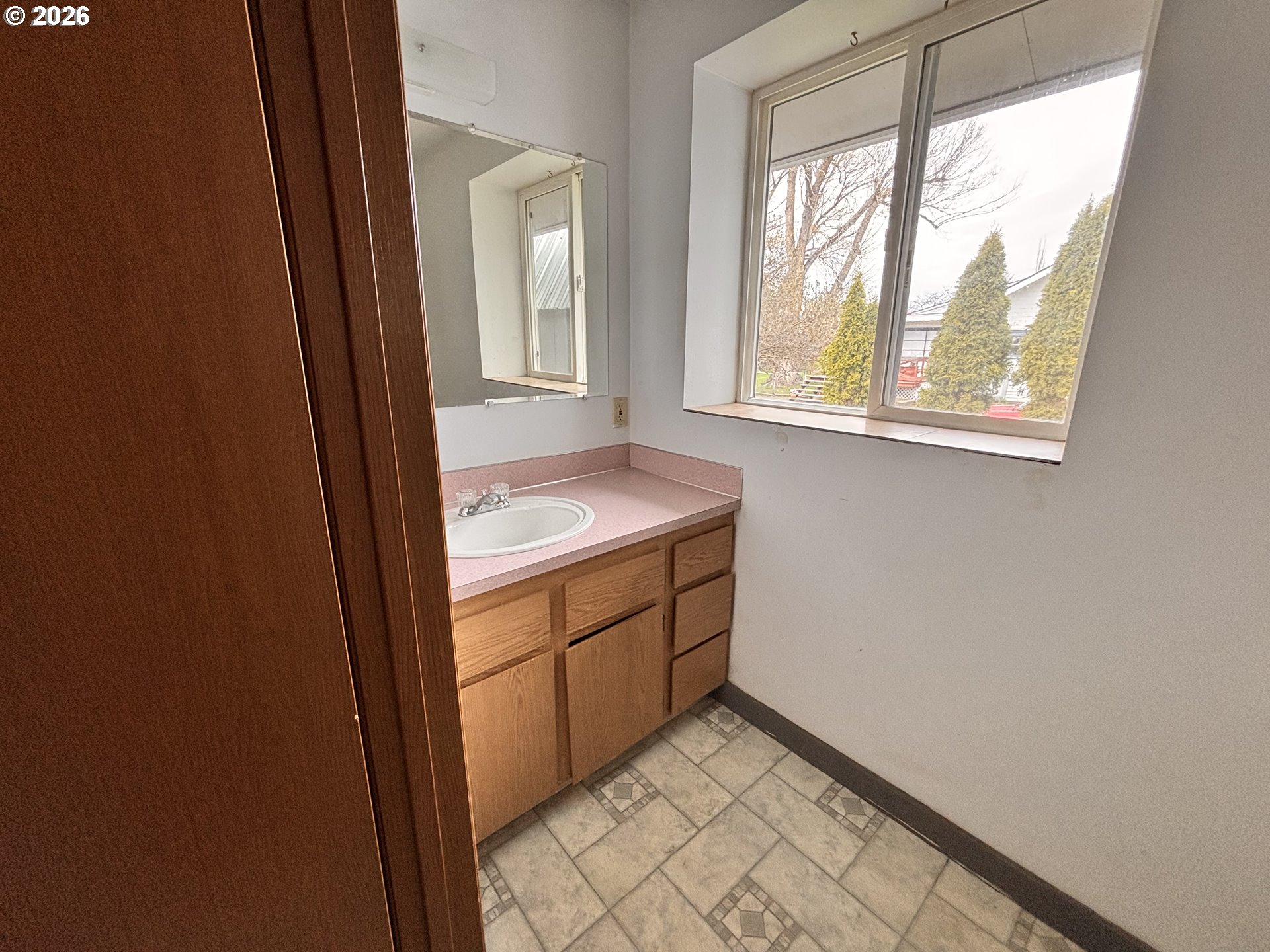 302 Southwest Depot Street Enterprise, OR 97828 - Photo 12 of 22 a utility room with window and washer