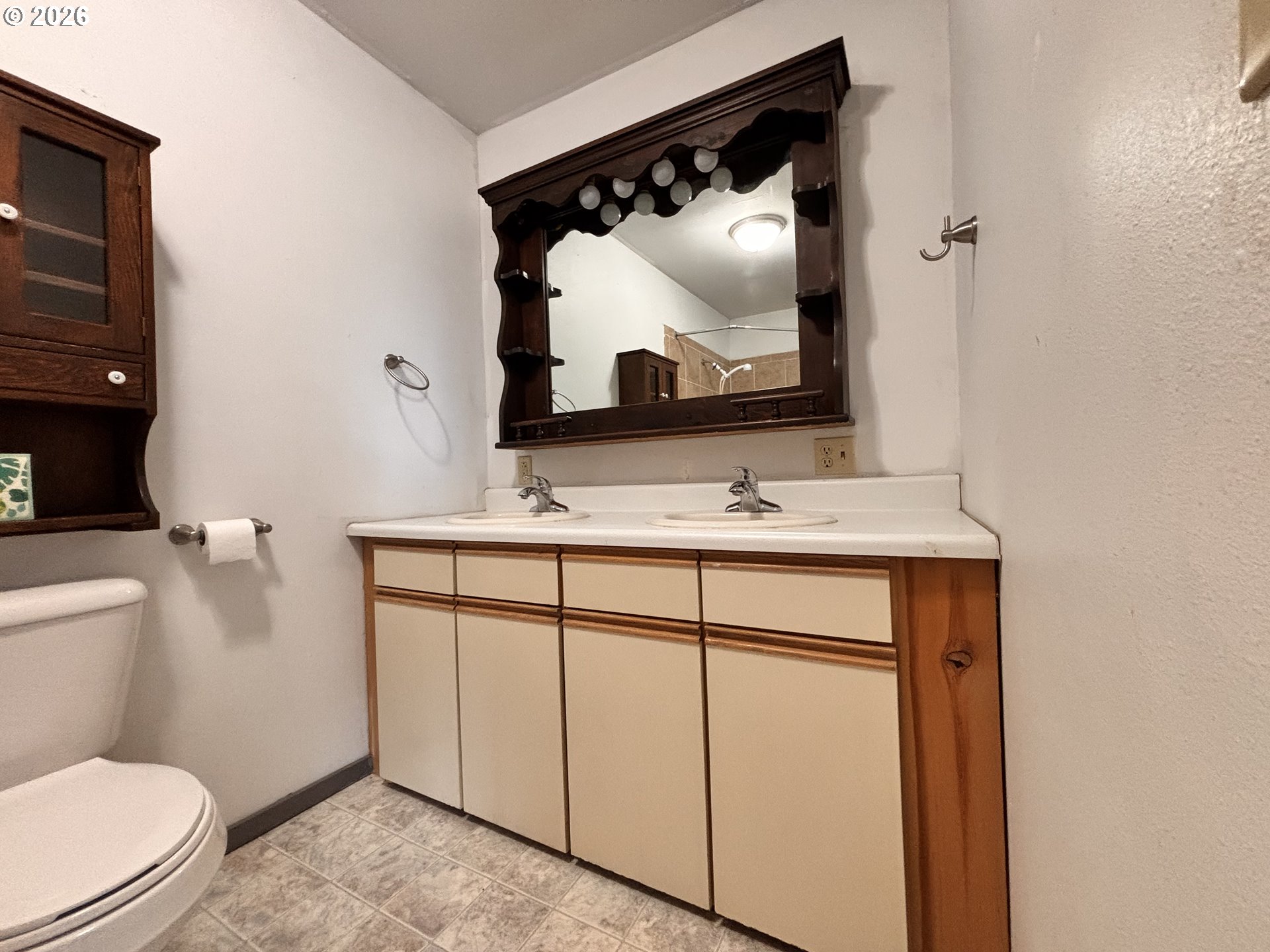 302 Southwest Depot Street Enterprise, OR 97828 - Photo 14 of 22 a bathroom with a sink vanity mirror and toilet