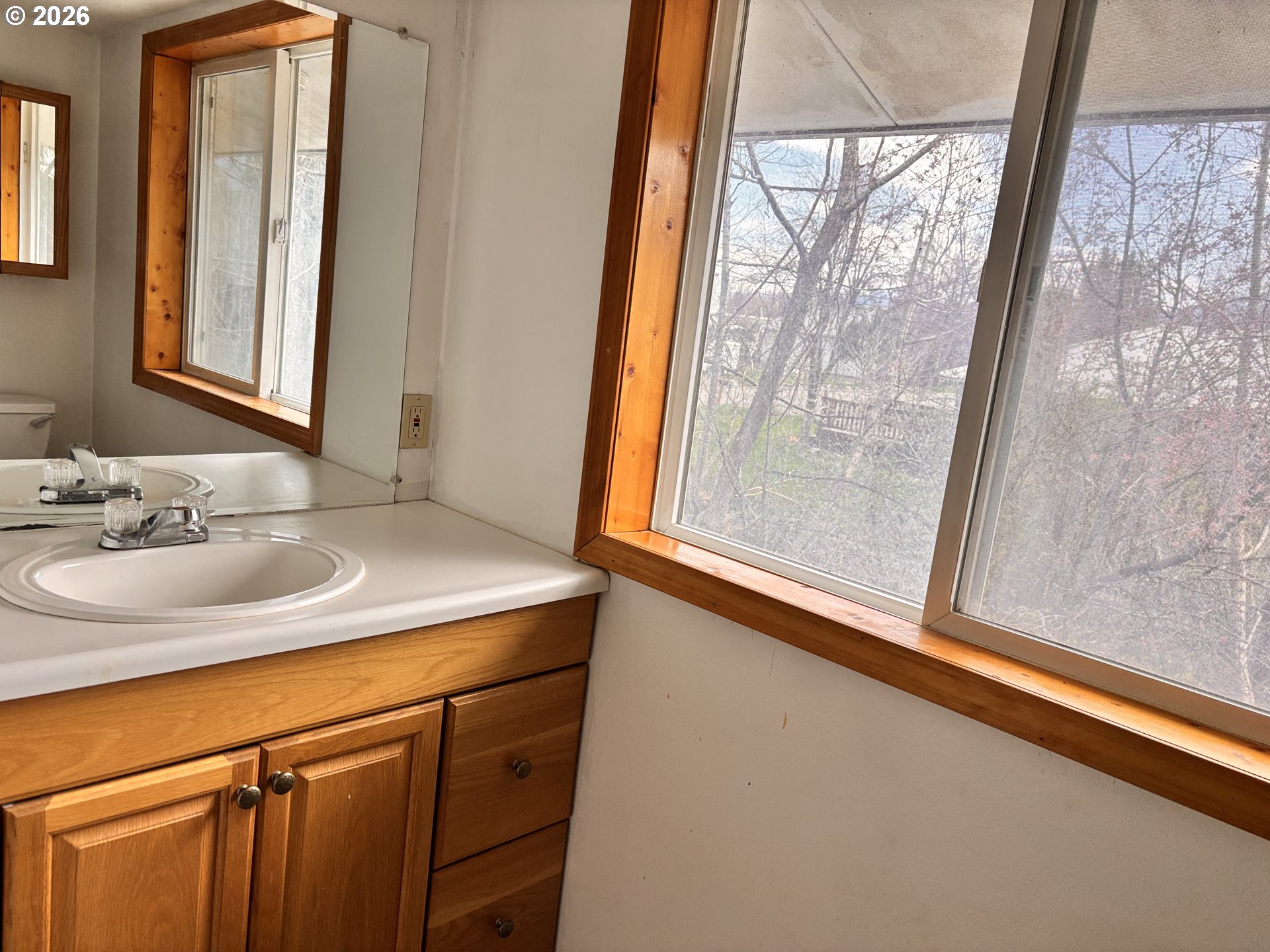 302 Southwest Depot Street Enterprise, OR 97828 - Photo 6 of 22 a bathroom with a sink and a mirror