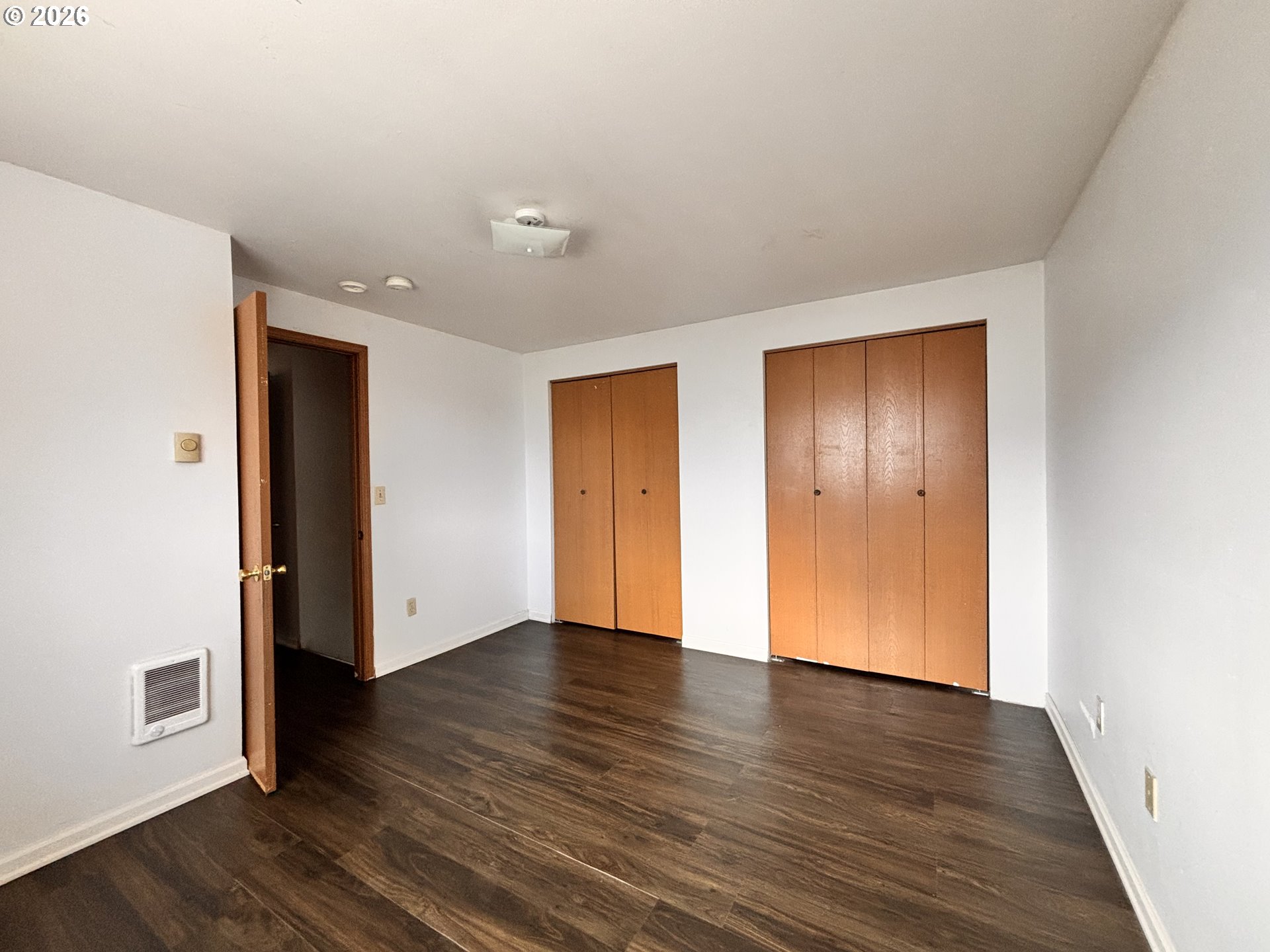 302 Southwest Depot Street Enterprise, OR 97828 - Photo 8 of 22 a view of an empty room with wooden floor and closet