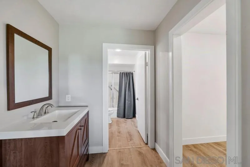 1944 Fairway Cir Drive San Marcos, CA 92078 - Photo 12 of 38 a bathroom with a sink and a mirror