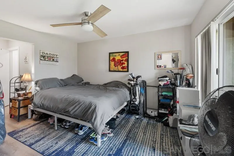 1944 Fairway Cir Drive San Marcos, CA 92078 - Photo 21 of 38 a bedroom with a bed and wooden floor