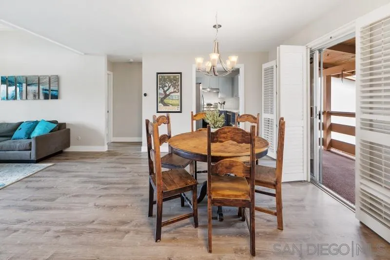 1944 Fairway Cir Drive San Marcos, CA 92078 - Photo 5 of 38 a dining room with furniture a chandelier and wooden floor