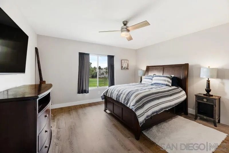 1944 Fairway Cir Drive San Marcos, CA 92078 - Photo 10 of 38 a bedroom with a bed and a flat screen tv