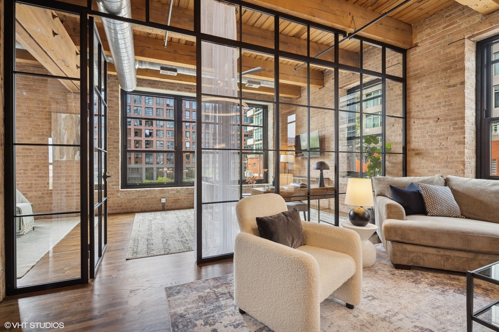 14 North Peoria Street, Unit 3E Chicago, IL 60607 - Photo 12 of 27 a living room with furniture and a floor to ceiling window