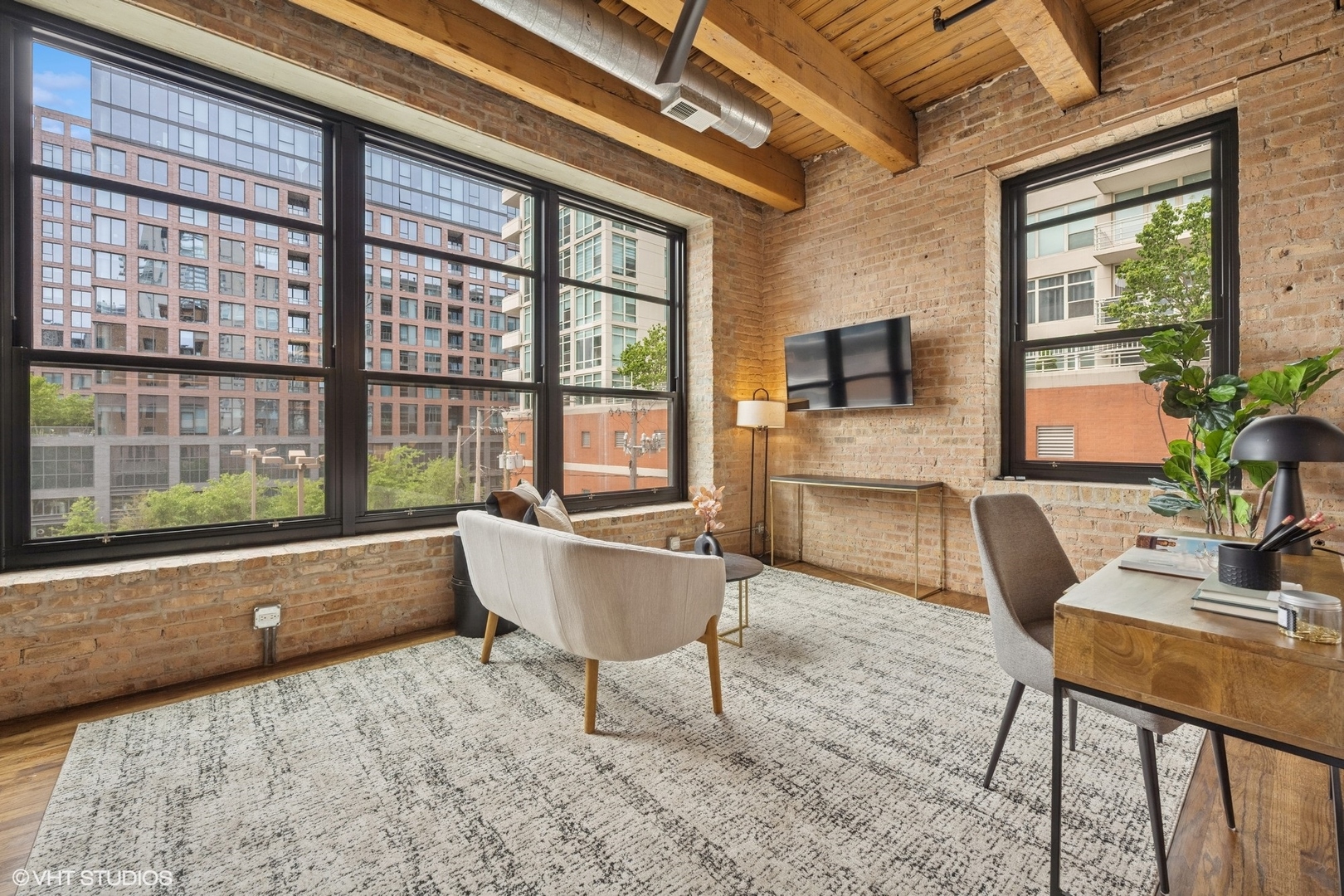 14 North Peoria Street, Unit 3E Chicago, IL 60607 - Photo 14 of 27 a living room with furniture and a flat screen tv