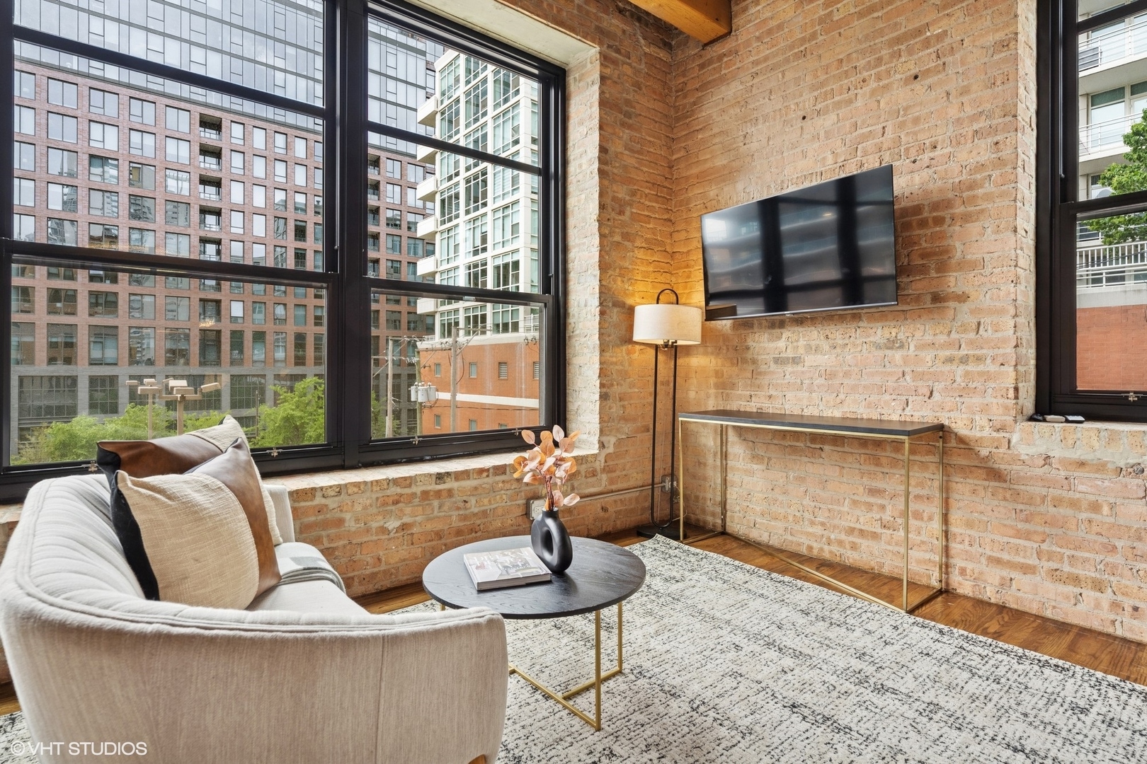 14 North Peoria Street, Unit 3E Chicago, IL 60607 - Photo 15 of 27 a living room with furniture and a flat screen tv