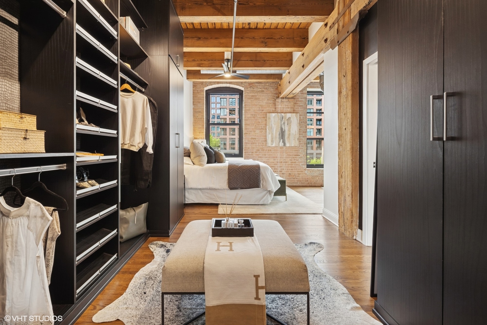 14 North Peoria Street, Unit 3E Chicago, IL 60607 - Photo 21 of 27 a view of walk in closet with clothes and shoes