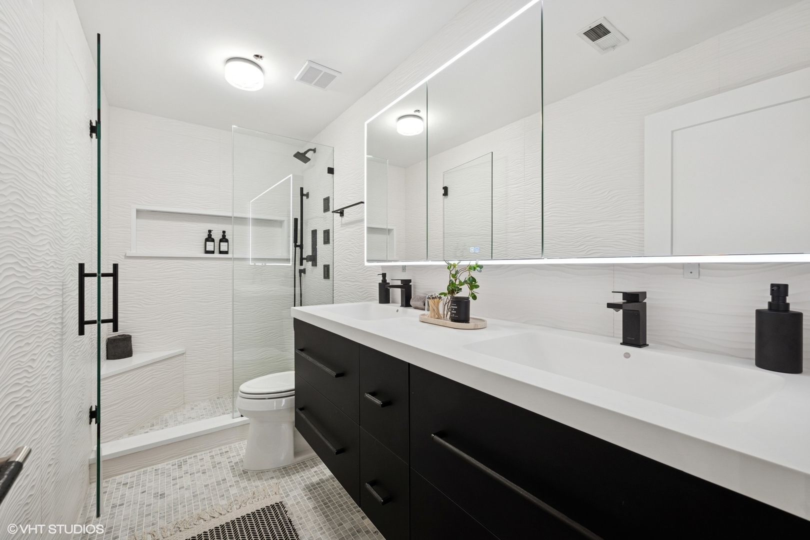 14 North Peoria Street, Unit 3E Chicago, IL 60607 - Photo 22 of 27 a kitchen with a sink a toilet a mirror and shower