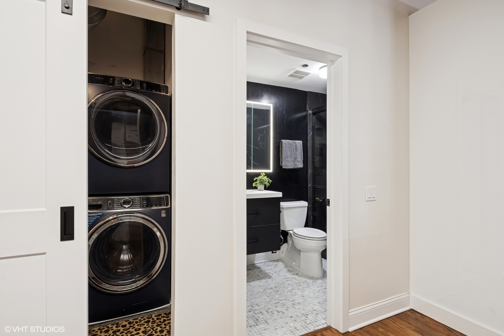 14 North Peoria Street, Unit 3E Chicago, IL 60607 - Photo 25 of 27 a view of a hallway with washer and dryer