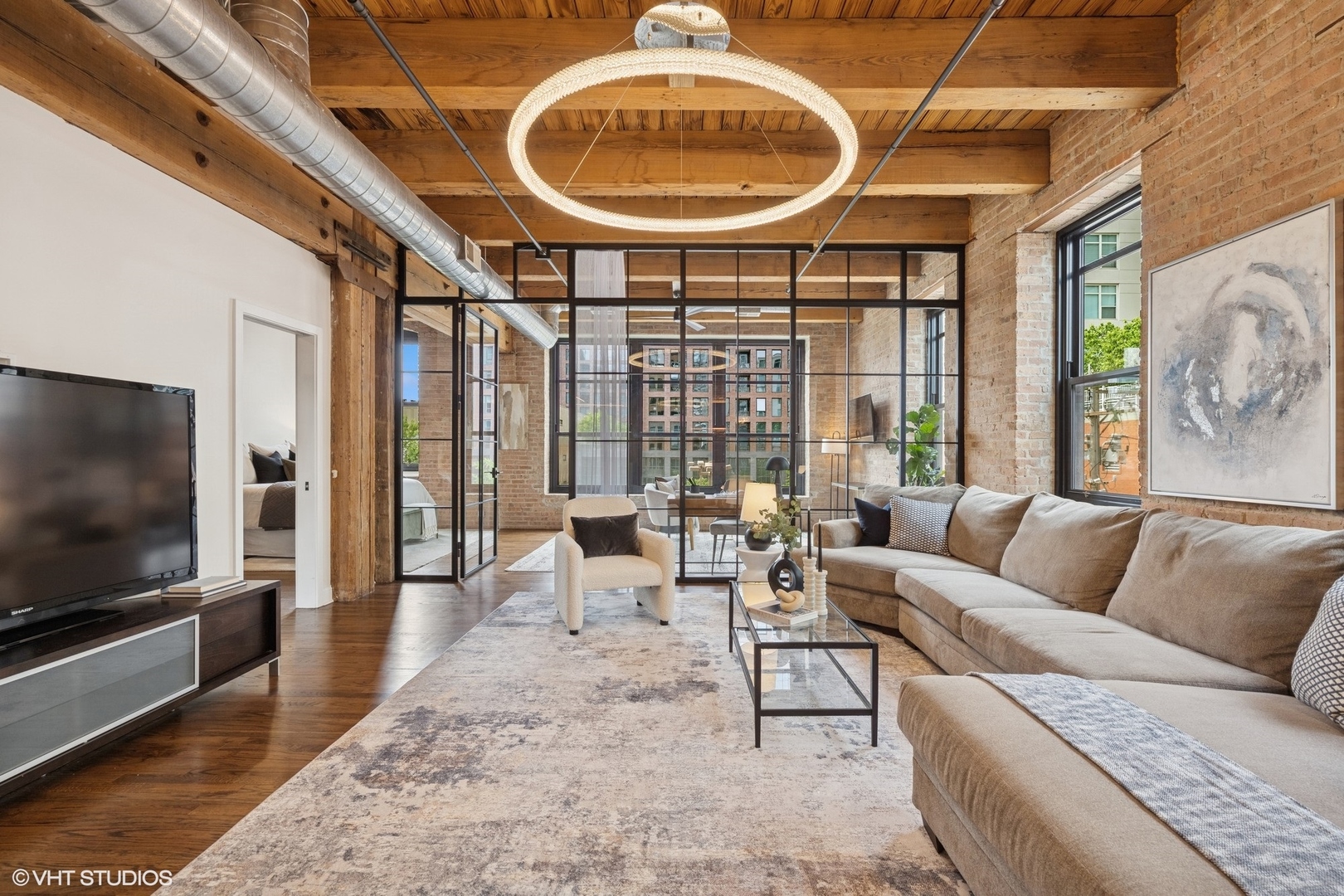 14 North Peoria Street, Unit 3E Chicago, IL 60607 - Photo 3 of 27 a living room with furniture a rug and a flat screen tv