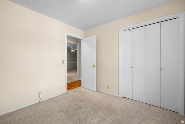 2088 Falcon Way Sandy, UT 84093 - Photo 16 of 46 Neutral-toned walls complement light-colored carpet flooring