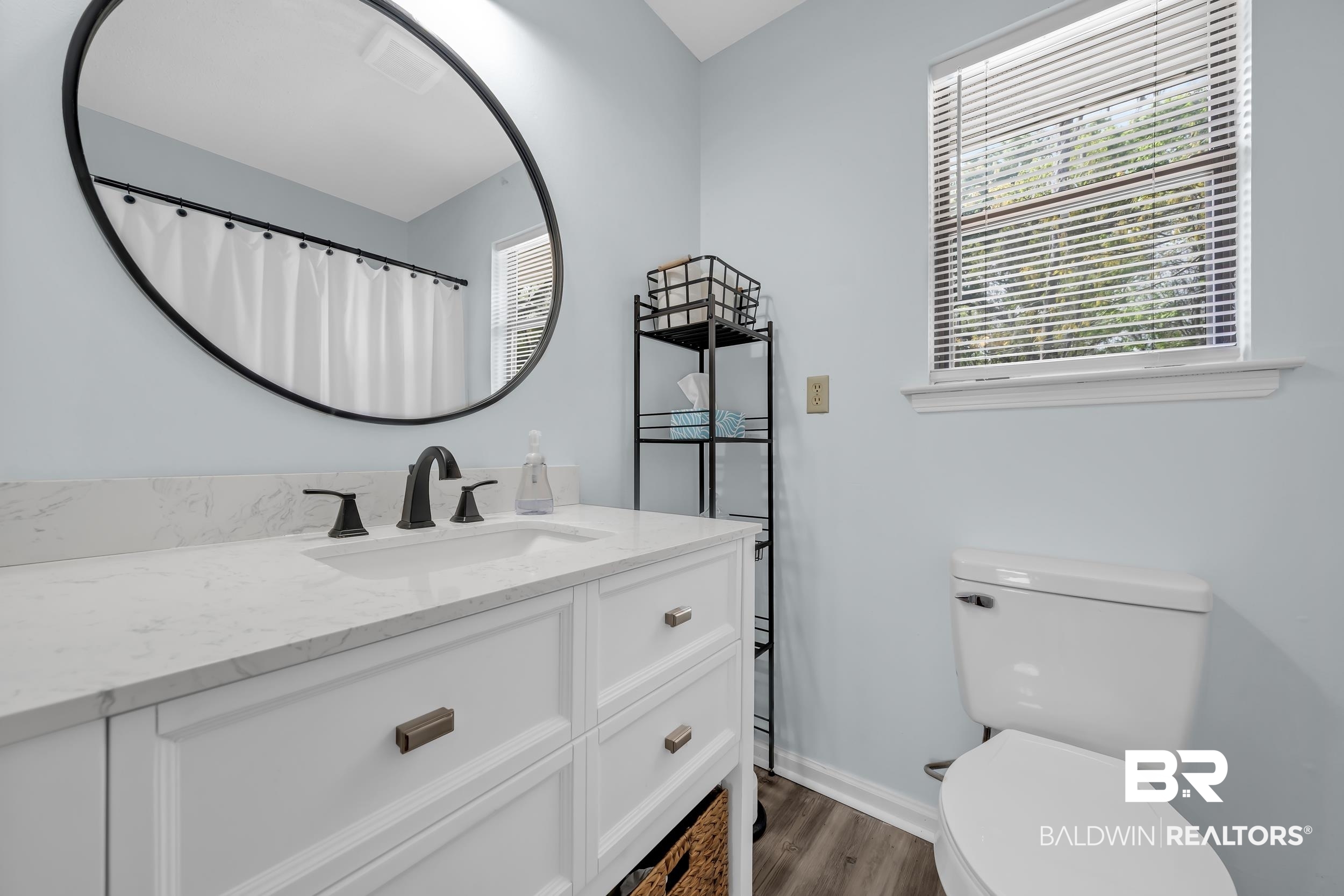 8081 Bryant's Lndg Road Stockton, AL 36579 - Photo 30 of 48 Full bath with vanity, dark wood-style flooring, and a shower with shower curtain