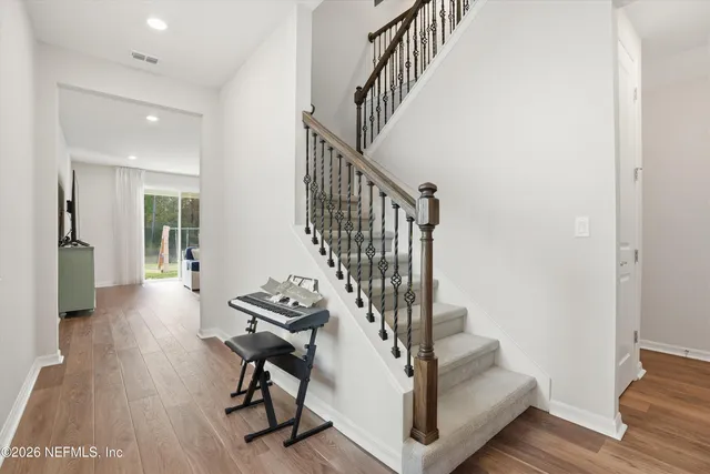 a bedroom with a bed and a night stand