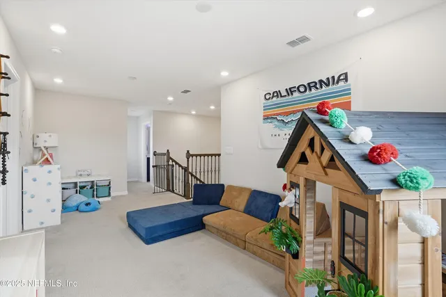 a bedroom with furniture and a book shelf