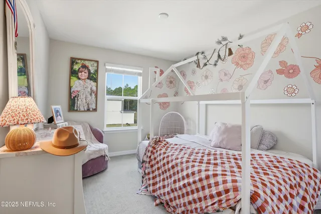 a bedroom with furniture and a window