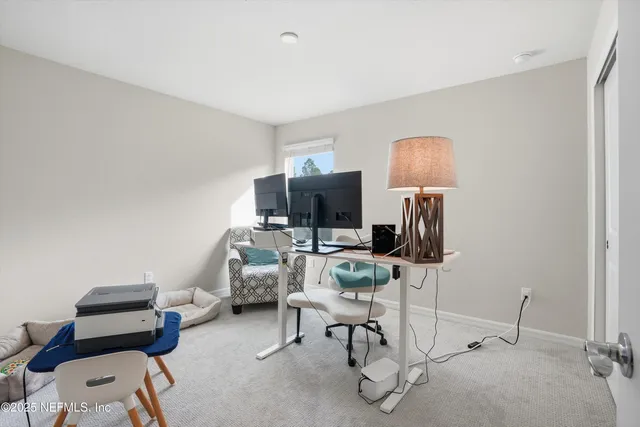 a room with furniture a flat screen tv and a window