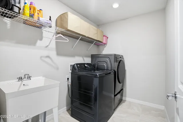 a utility room with dryer and washer