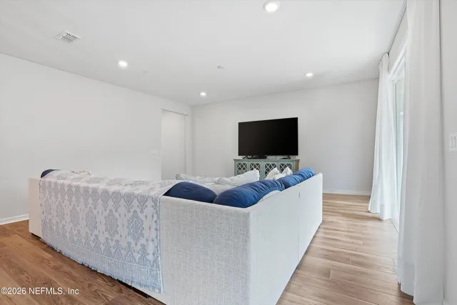 a bedroom with a large bed and a table