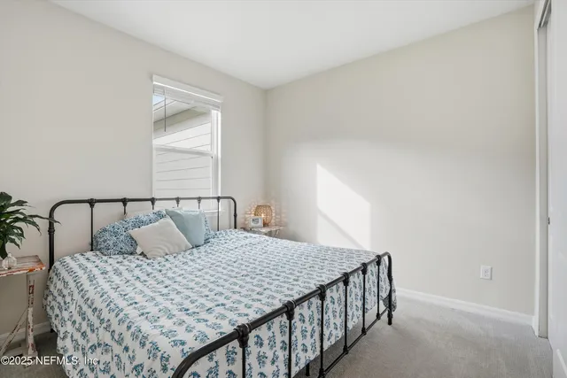 a bedroom with a large bed and a table