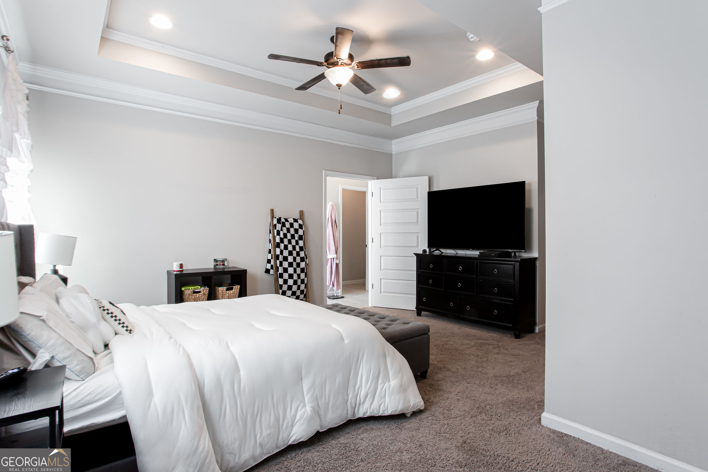 95 Bromes Street Lawrenceville, GA 30046 - Photo 16 of 37 a bedroom with a bed and a flat screen tv