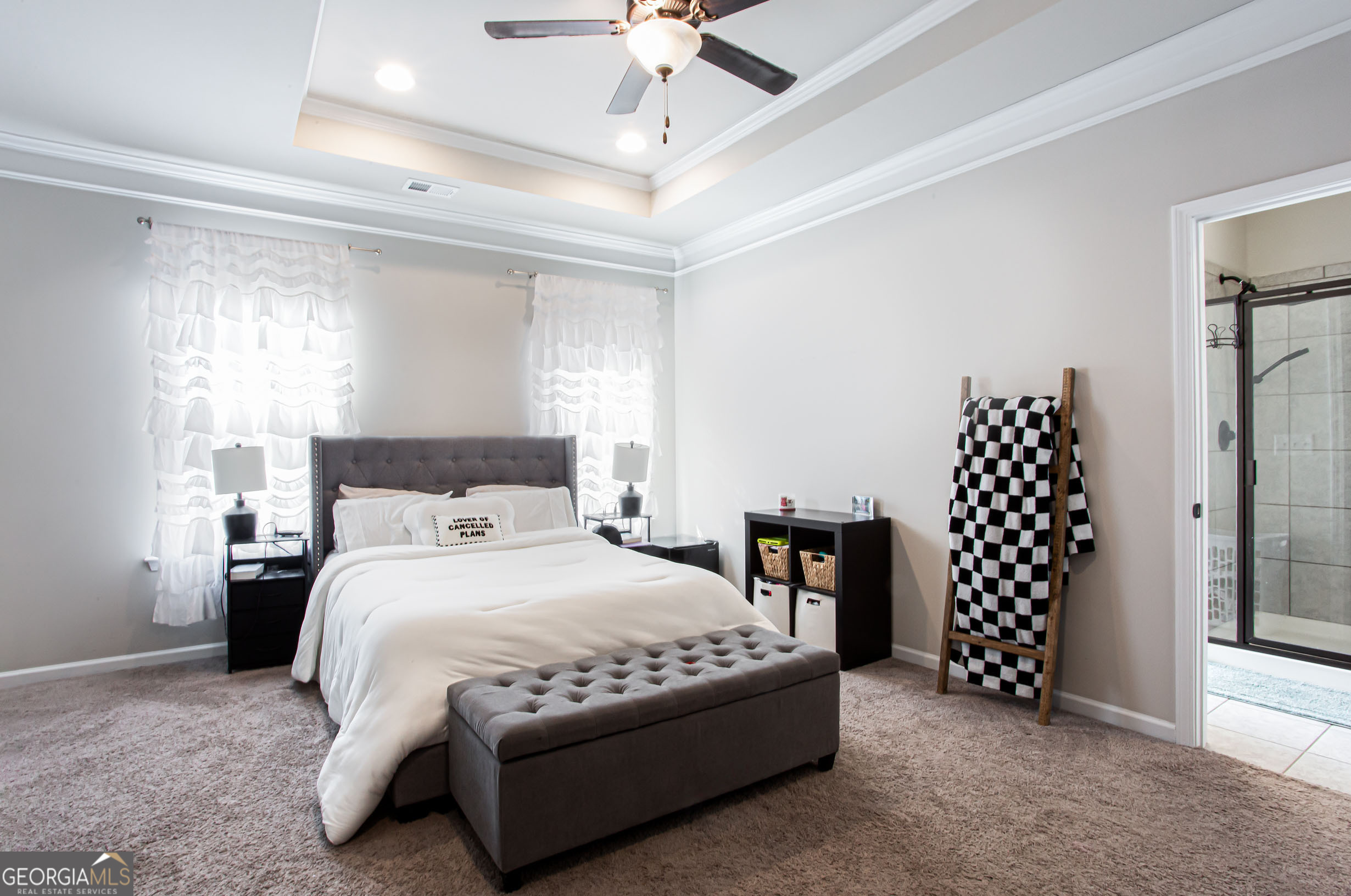 95 Bromes Street Lawrenceville, GA 30046 - Photo 17 of 37 a bedroom with a bed and a large walk in closet