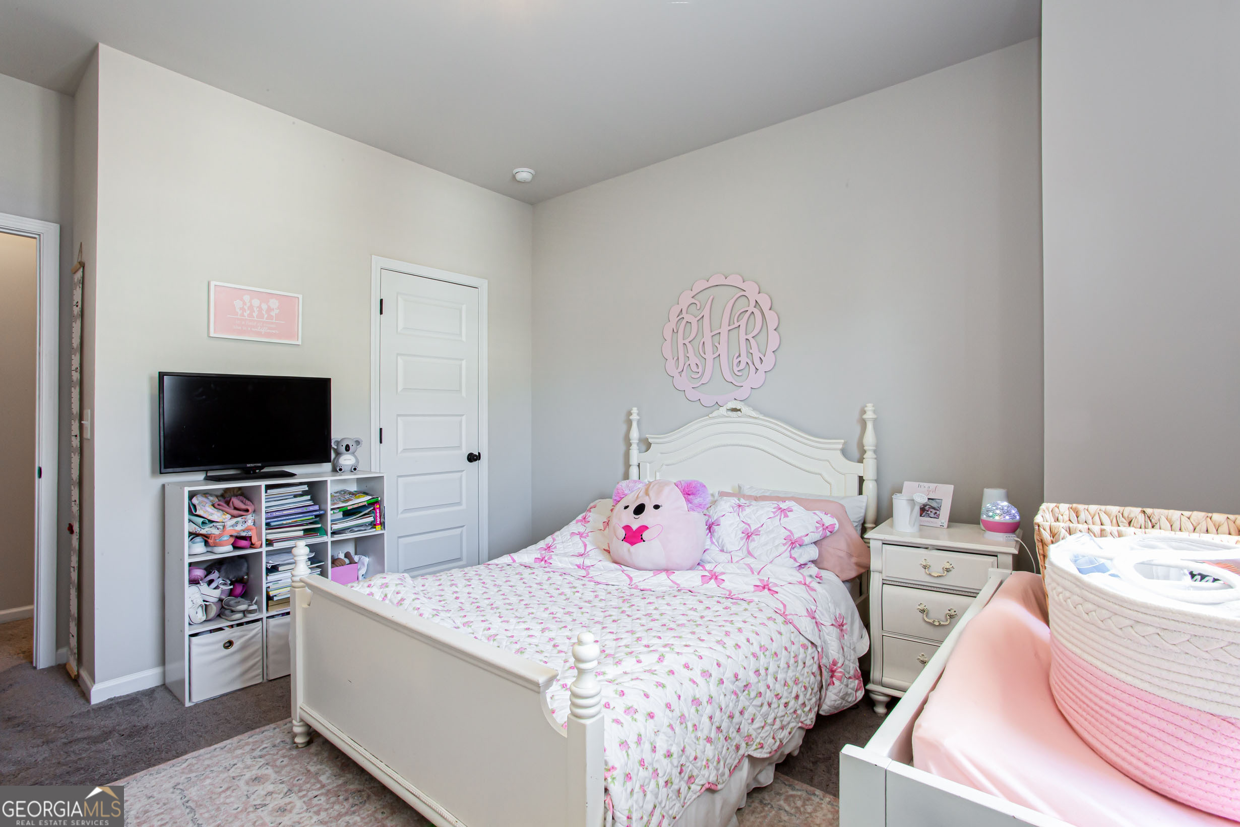 95 Bromes Street Lawrenceville, GA 30046 - Photo 23 of 37 a bedroom with a bed and a flat screen tv