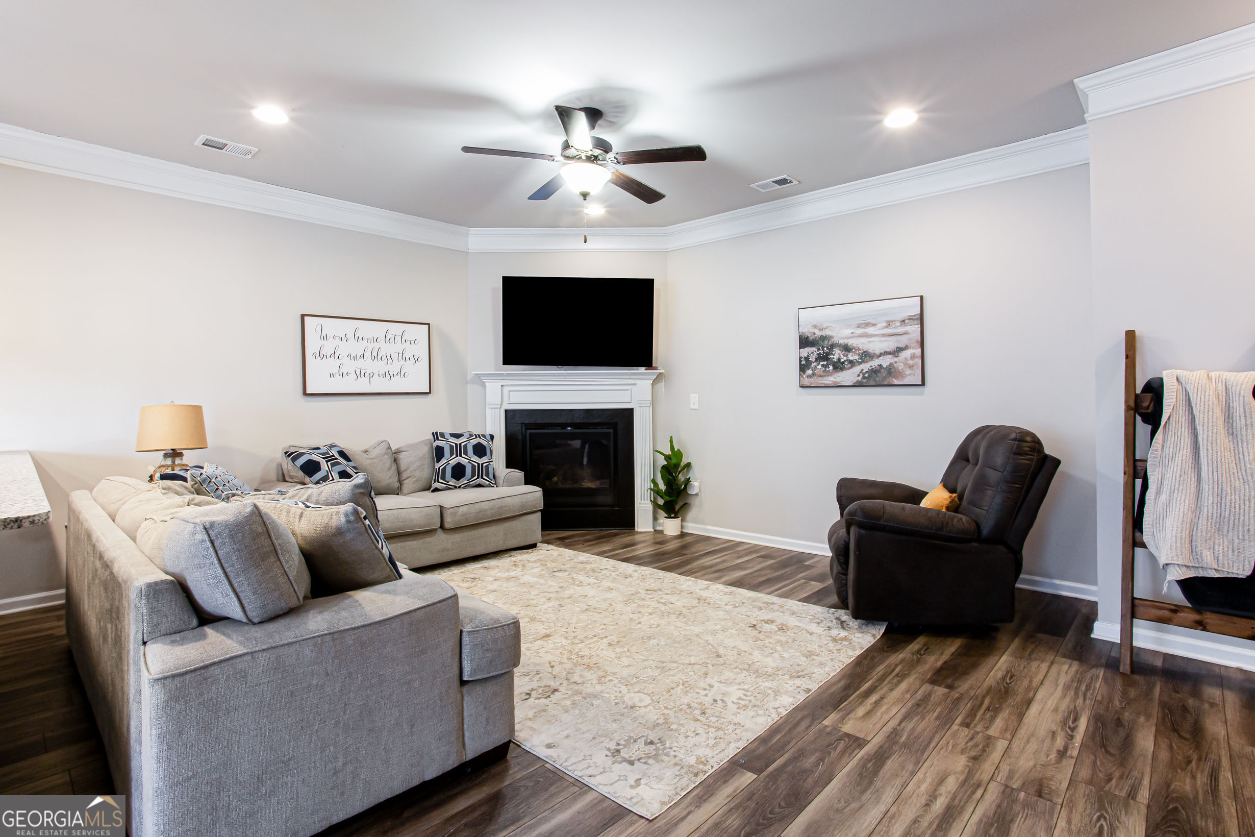 95 Bromes Street Lawrenceville, GA 30046 - Photo 10 of 37 a living room with furniture and a flat screen tv