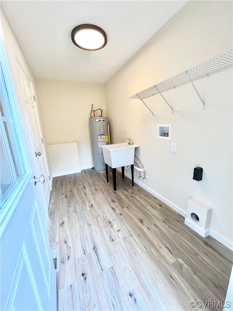 6626 Jackson Road Quinton, VA 23141 - Photo 25 of 40 Laundry room with water heater, sink, washer hooku
