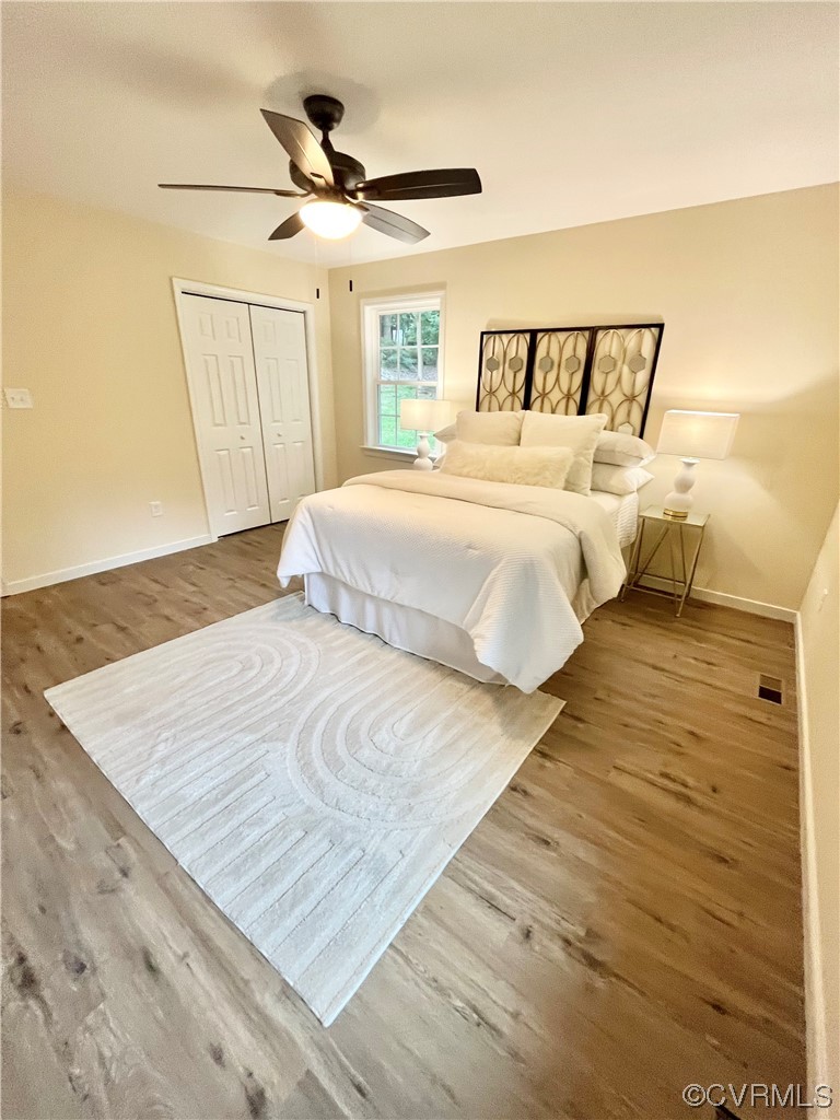 6626 Jackson Road Quinton, VA 23141 - Photo 9 of 40 LVP floored primary bedroom featuring ceiling fan,