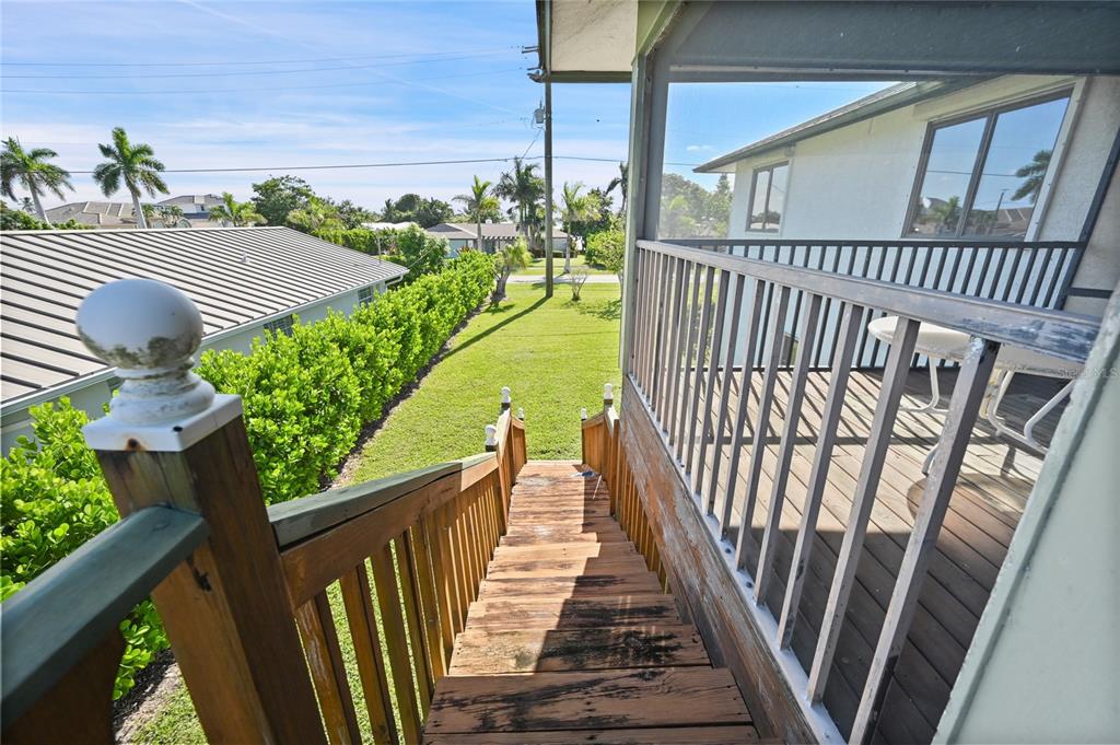 103 Tahiti Circle Naples, FL 34113 - Photo 29 of 37 a view of balcony with wooden floor