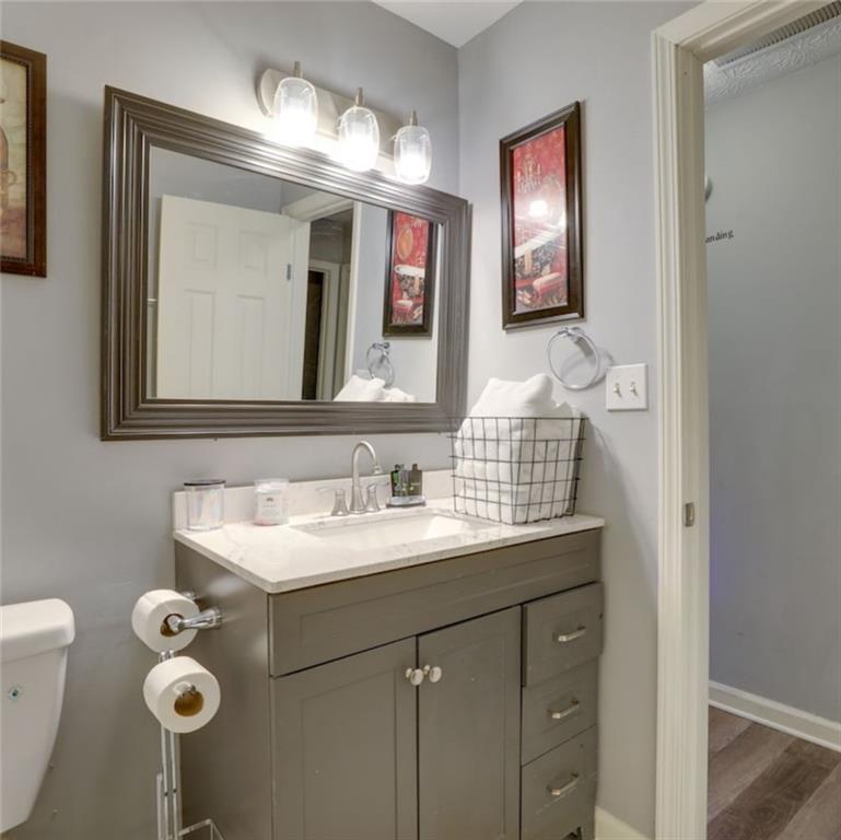 3468 Deer Trace Lithonia, GA 30038 - Photo 13 of 18 a bathroom with a sink double vanity and a mirror