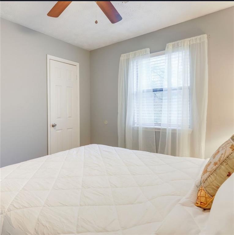 3468 Deer Trace Lithonia, GA 30038 - Photo 14 of 18 a large white bed in a white room