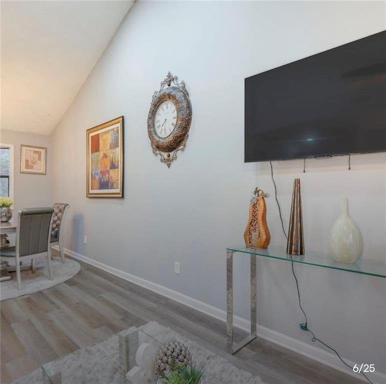 3468 Deer Trace Lithonia, GA 30038 - Photo 2 of 18 a view of a room with wooden floor and windows