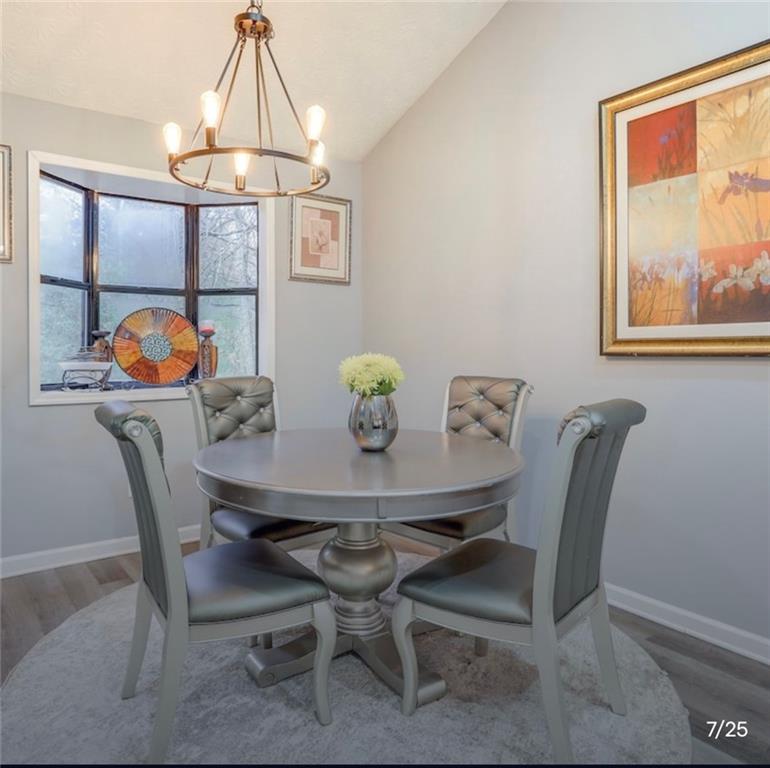 3468 Deer Trace Lithonia, GA 30038 - Photo 4 of 18 a view of a dining room that has a table and chairs