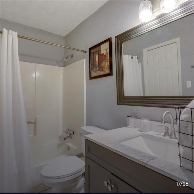 3468 Deer Trace Lithonia, GA 30038 - Photo 6 of 18 a bathroom with a sink toilet and shower
