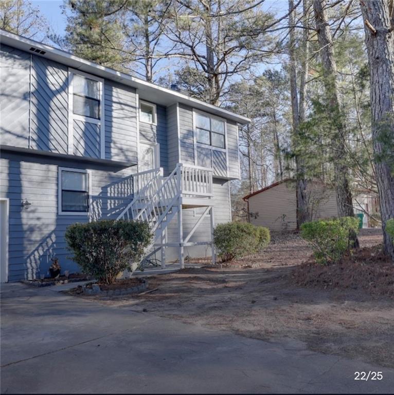 3468 Deer Trace Lithonia, GA 30038 - Photo 7 of 18 a front view of a house with garden
