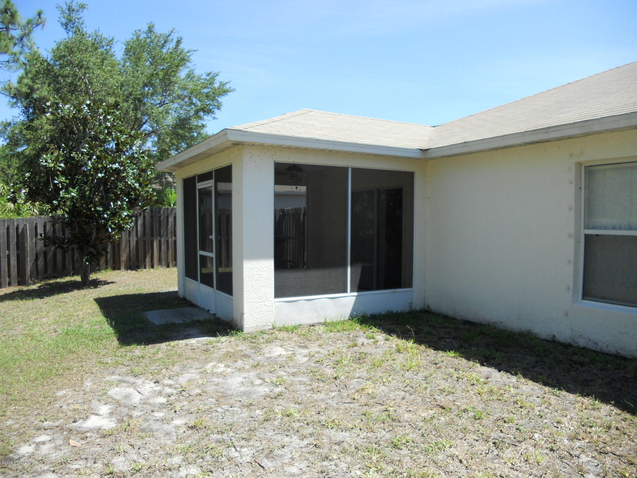 540 Benton Drive Melbourne, FL 32901 - Photo 14 of 14 a front view of a house with a yard