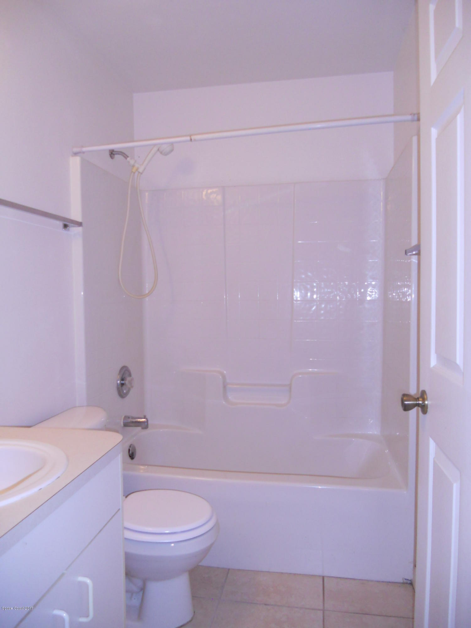 540 Benton Drive Melbourne, FL 32901 - Photo 9 of 14 a bathroom with a shower toilet and sink