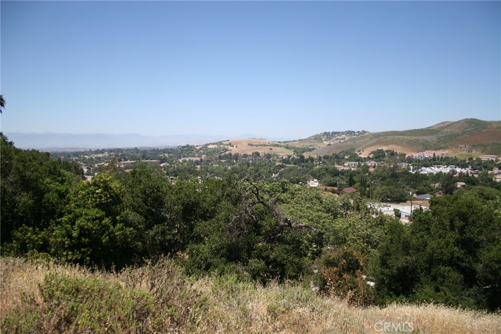 0 Foothill & Manzanita Thousand Oaks, CA 91361 - Photo 4 of 9 a view of a lush green field with mountains in the background