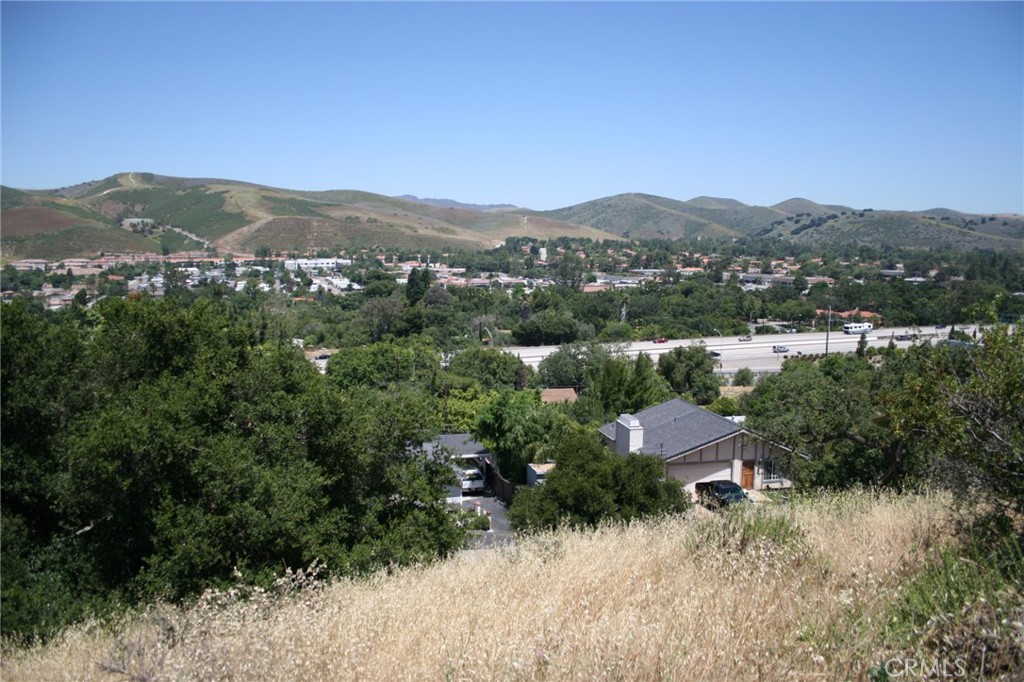 0 Foothill & Manzanita Thousand Oaks, CA 91361 - Photo 6 of 9 a view of a lush green field with mountains in the background
