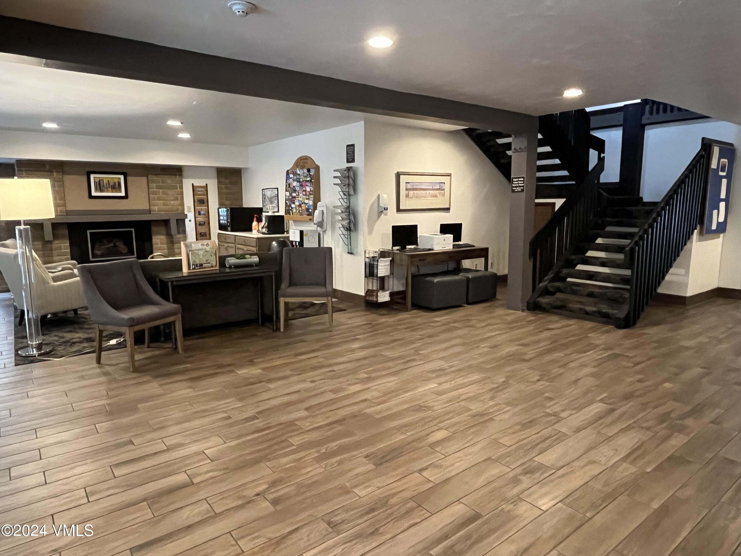 1020 Vail View Drive, Unit 130432 Vail, CO 81657 - Photo 16 of 20 a living room with furniture and a wooden floor