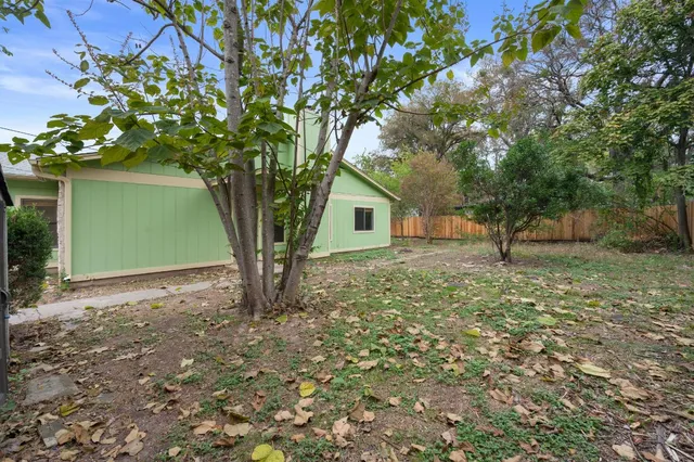 a view of a house with a tree