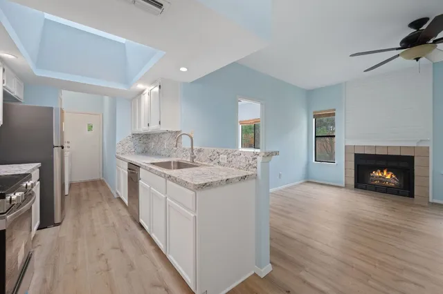 a kitchen with a sink stove and refrigerator