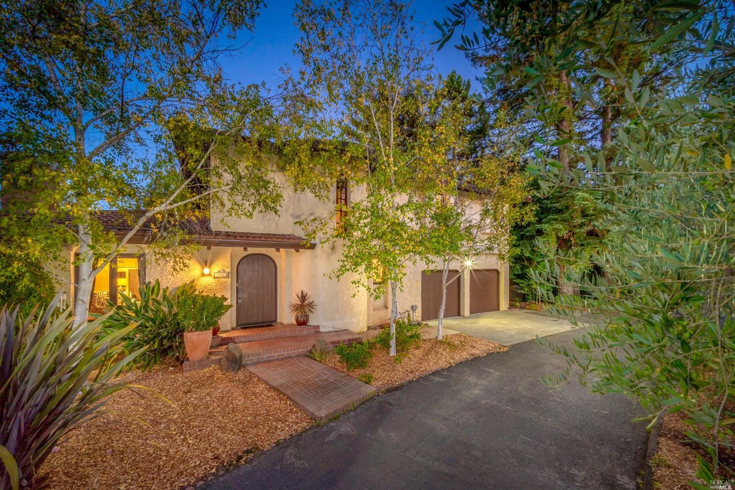 1722 Willowside Road Santa Rosa, CA 95401 - Photo 1 of 1 a view of a house with a tree and flower plants