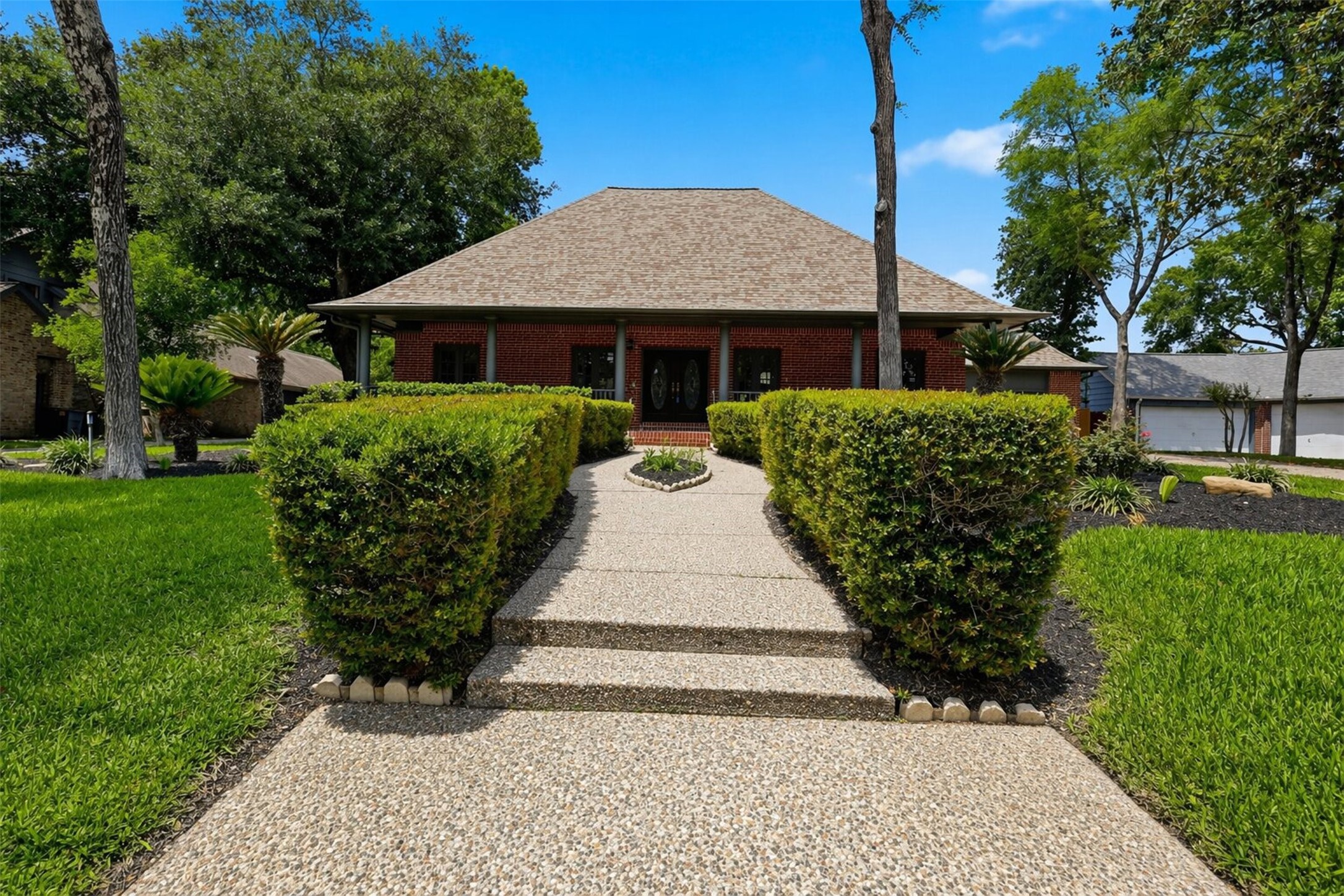 6118 Hampton Way Court Spring, TX 77389 - Photo 24 of 27 Well Manicured Multi-level Front view of the home, The front of the home offers an extensive covered front porch measuring at 52' x 8'.