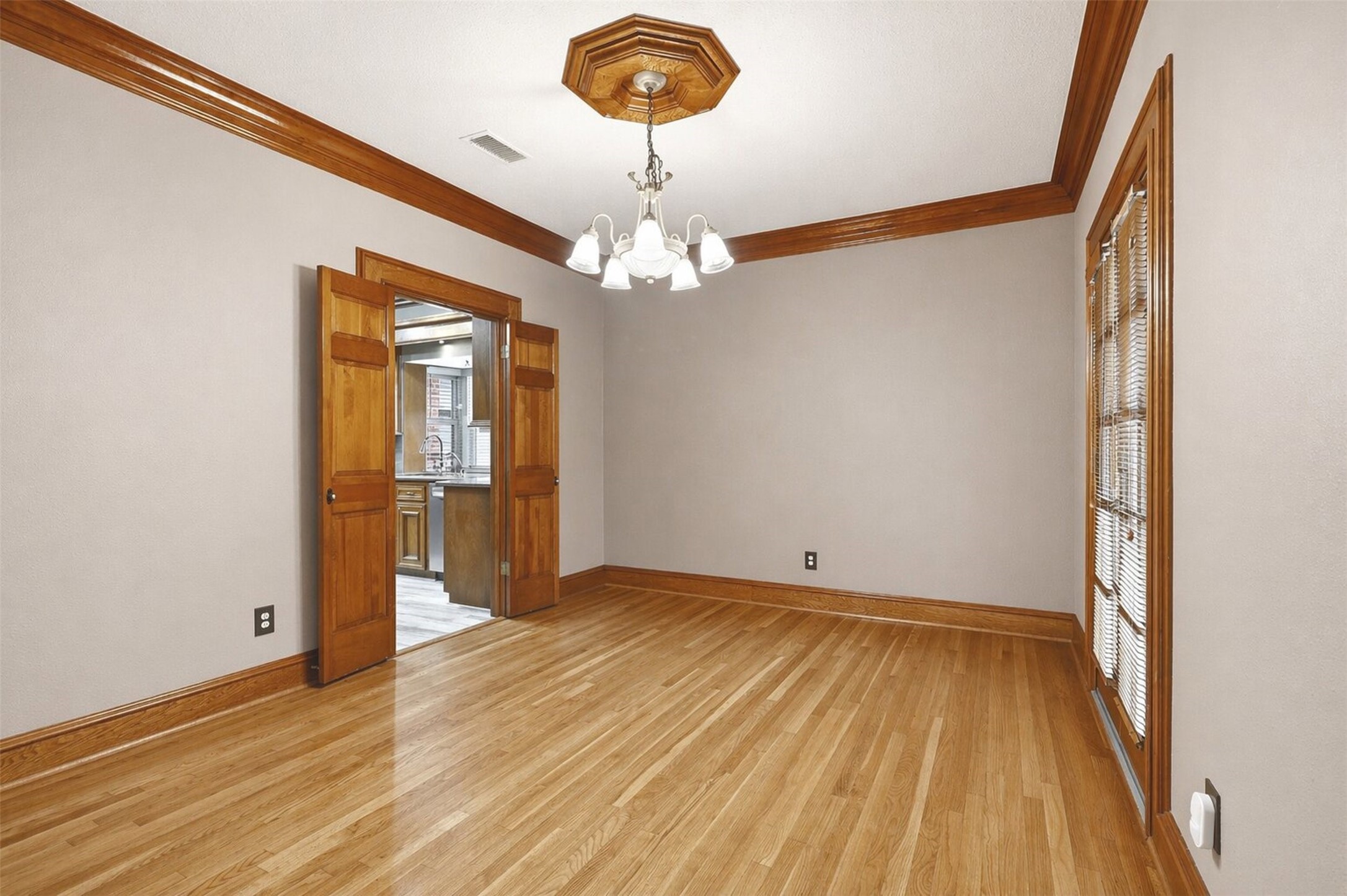 6118 Hampton Way Court Spring, TX 77389 - Photo 8 of 27 Another view of the Dining room with double doors for privacy. Crown molding, wood baseboards, wood trim. Host your next holiday dinner in this beautiful dining room.