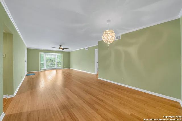 a view of livingroom with window and wooden floor